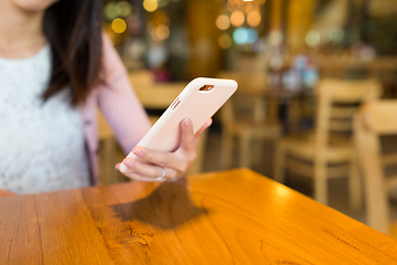 Image showing Woman use of cellphone in cafe