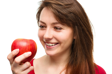 Image showing Young happy girl with apple