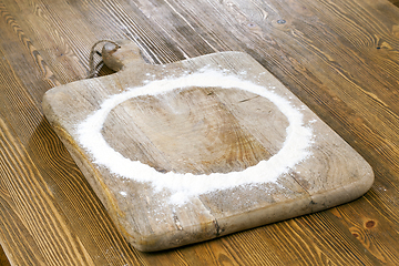 Image showing flour on wooden background