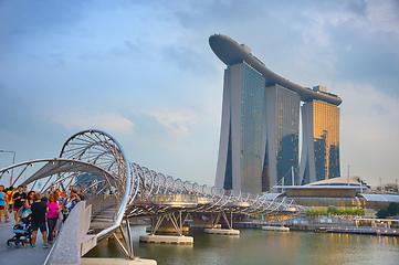 Image showing People walking by Marina Bay