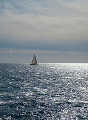 Image showing sail boat at horizon line