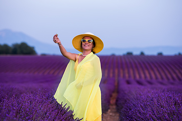 Image showing asian woman in yellow dress and hat at lavender field