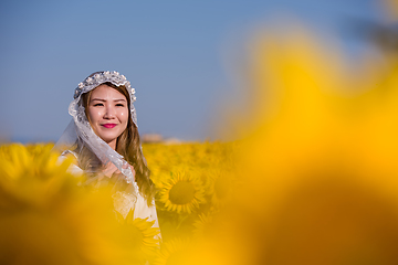 Image showing asian woman at sunflower field