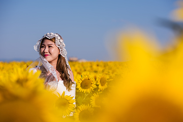 Image showing asian woman at sunflower field