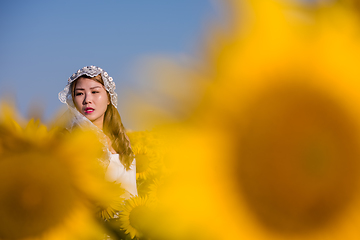 Image showing asian woman at sunflower field