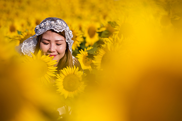 Image showing asian woman at sunflower field