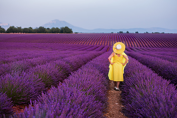 Image showing asian woman in yellow dress and hat at lavender field