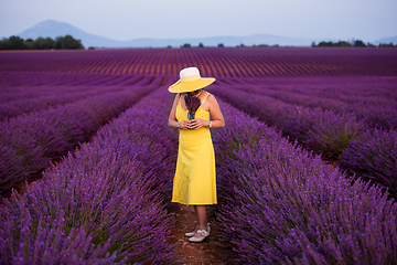 Image showing asian woman in yellow dress and hat at lavender field