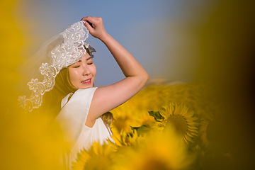 Image showing asian woman at sunflower field