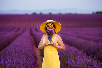 Image showing asian woman in yellow dress and hat at lavender field