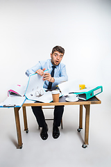 Image showing The ink in the pen ended abruptly and the man is forced to write in pencil