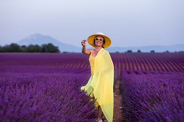 Image showing asian woman in yellow dress and hat at lavender field