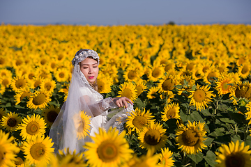 Image showing asian woman at sunflower field