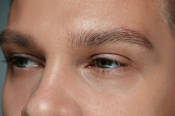 Image showing Close-up portrait of young man isolated on grey studio background