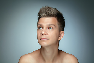 Image showing Portrait of shirtless young man isolated on grey studio background