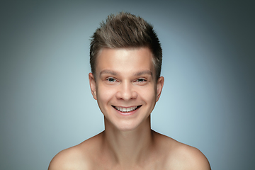 Image showing Portrait of shirtless young man isolated on grey studio background