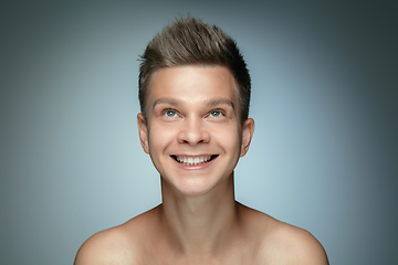 Image showing Portrait of shirtless young man isolated on grey studio background