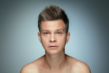 Image showing Portrait of shirtless young man isolated on grey studio background