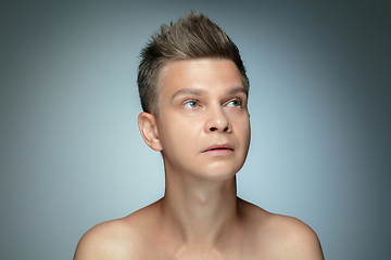 Image showing Portrait of shirtless young man isolated on grey studio background