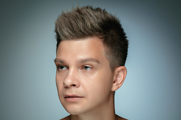 Image showing Portrait of shirtless young man isolated on grey studio background