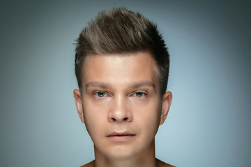 Image showing Portrait of shirtless young man isolated on grey studio background