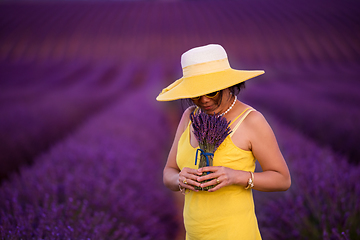 Image showing asian woman in yellow dress and hat at lavender field