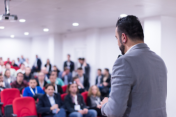 Image showing successful businessman giving presentations at conference room