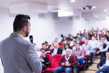 Image showing successful businessman giving presentations at conference room