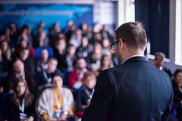 Image showing successful businessman giving presentations at conference room