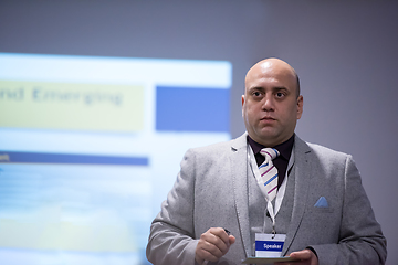 Image showing successful businessman giving presentations at conference room