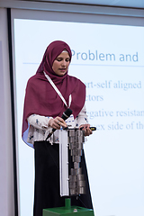 Image showing Muslim businesswoman giving presentations
