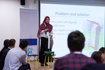 Image showing Muslim businesswoman giving presentations