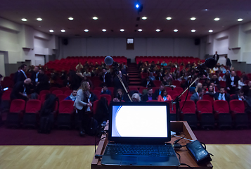 Image showing laptop computer and microphone at podium