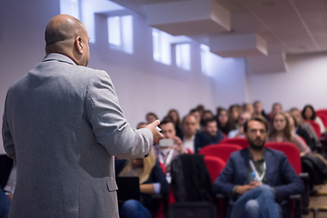 Image showing successful businessman giving presentations at conference room