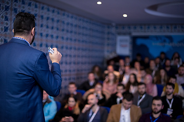 Image showing successful businessman giving presentations at conference room