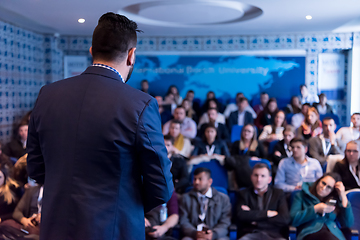 Image showing successful businessman giving presentations at conference room