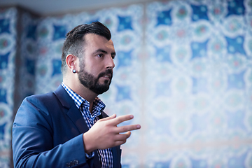 Image showing successful businessman giving presentations at conference room