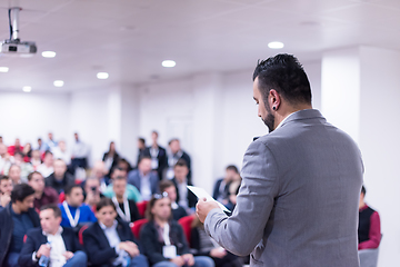 Image showing successful businessman giving presentations at conference room