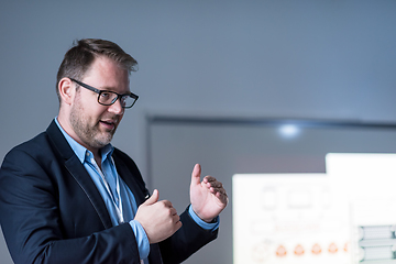 Image showing successful businessman giving presentations at conference room