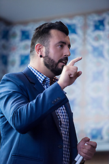 Image showing successful businessman giving presentations at conference room