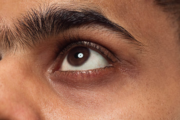 Image showing Close up portrait of young man on blue background.