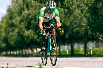 Image showing Dnipro, Ukraine - July 12, 2019: athlete with disabilities or amputee training in cycling