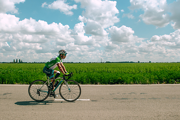 Image showing Dnipro, Ukraine - July 12, 2019: athlete with disabilities or amputee training in cycling