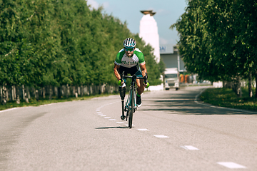 Image showing Dnipro, Ukraine - July 12, 2019: athlete with disabilities or amputee training in cycling