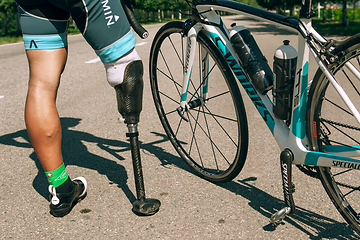 Image showing Dnipro, Ukraine - July 12, 2019: athlete with disabilities or amputee training in cycling