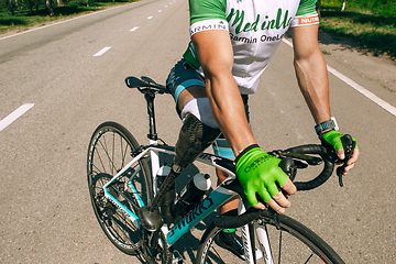 Image showing Dnipro, Ukraine - July 12, 2019: athlete with disabilities or amputee training in cycling