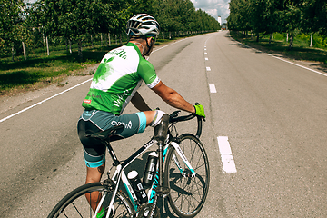 Image showing Dnipro, Ukraine - July 12, 2019: athlete with disabilities or amputee training in cycling