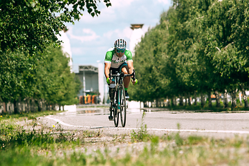 Image showing Dnipro, Ukraine - July 12, 2019: athlete with disabilities or amputee training in cycling