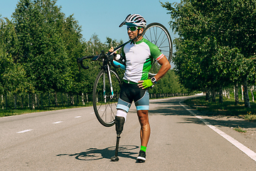 Image showing Athlete disabled amputee training in cycling