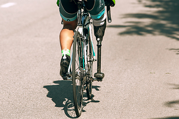 Image showing Dnipro, Ukraine - July 12, 2019: athlete with disabilities or amputee training in cycling